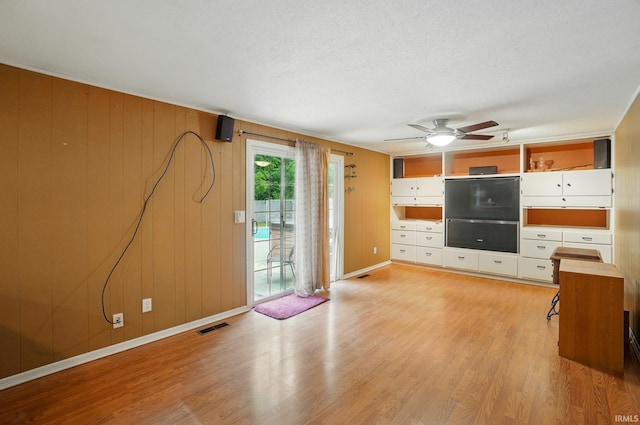 5820 Rosedale Dr, Fort Wayne, IN 46804 - unfurnished living room with light wood-style flooring, ceiling fan, and a textured ceiling