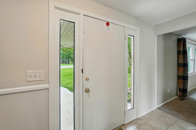 5820 Rosedale Dr, Fort Wayne, IN 46804 - entrance foyer with light tile patterned floors and baseboards