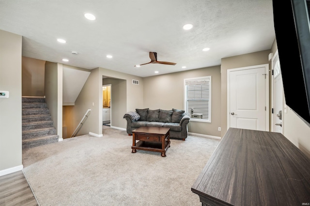 1729 Carter Ct, Mishawaka, IN 46545 - living room featuring ceiling fan, recessed lighting, stairs, and light carpet