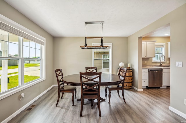 1729 Carter Ct, Mishawaka, IN 46545 - dining area featuring light wood finished floors and healthy amount of natural light