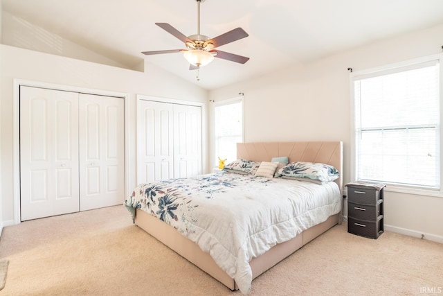 1250 W Adams Hill Cir Unit 104, Bloomington, IN 47403 - bedroom featuring carpet flooring, multiple closets, lofted ceiling, and ceiling fan