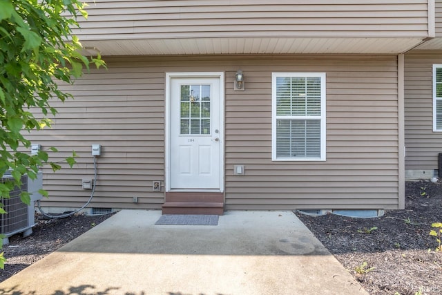 1250 W Adams Hill Cir Unit 104, Bloomington, IN 47403 - view of exterior entry featuring crawl space and a patio area