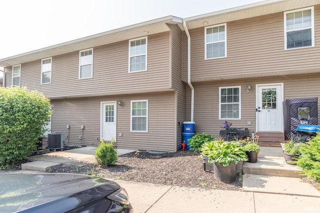 1250 W Adams Hill Cir Unit 104, Bloomington, IN 47403 - rear view of house with entry steps