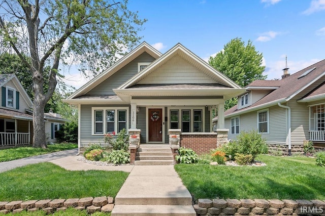 1106 W Maple St, Kokomo, IN 46901 - view of front of property featuring a porch and a front yard