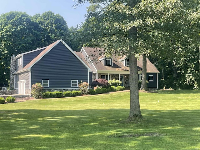 3626 E 200th Rd, Logansport, IN 46947 - cape cod house with a front yard and stone siding