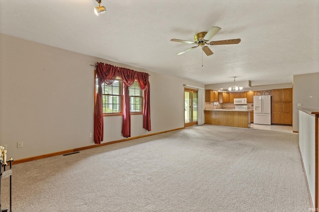 29230 Walerko Dr, Elkhart, IN 46514 - unfurnished living room with a chandelier, ceiling fan, light colored carpet, and a textured ceiling