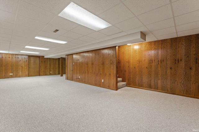 29230 Walerko Dr, Elkhart, IN 46514 - finished basement featuring a drop ceiling, wood walls, carpet, and stairway