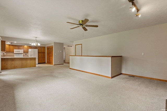 29230 Walerko Dr, Elkhart, IN 46514 - unfurnished living room with a chandelier, light colored carpet, and a ceiling fan