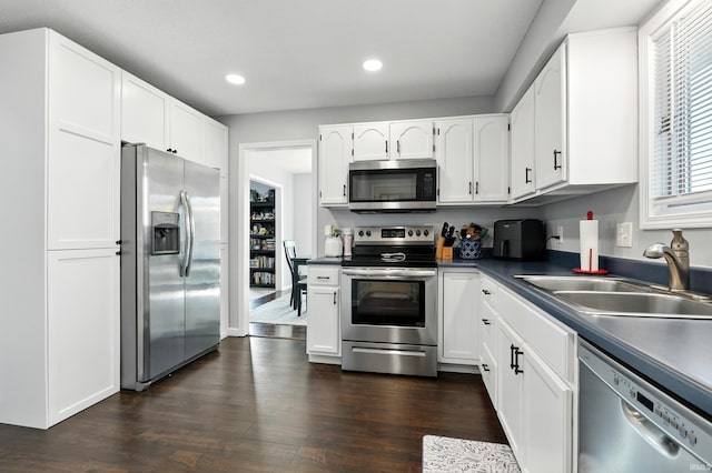 10412 Kentfield Pl, Fort Wayne, IN 46818 - kitchen featuring appliances with stainless steel finishes, recessed lighting, dark wood-style floors, and white cabinets