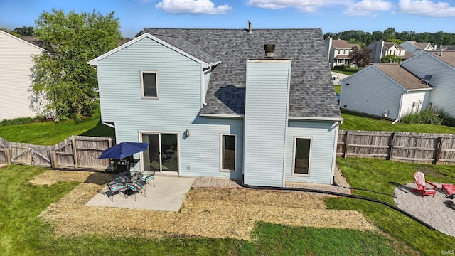 10412 Kentfield Pl, Fort Wayne, IN 46818 - rear view of house with a shingled roof, a gate, a patio, a fenced backyard, and a chimney