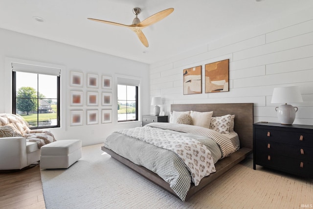 11306 Fishers Pond, Middlebury, IN 46540 - bedroom featuring multiple windows, light wood-style floors, and a ceiling fan
