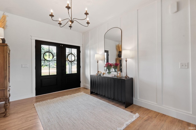 11306 Fishers Pond, Middlebury, IN 46540 - entrance foyer with a chandelier, light wood-style flooring, and french doors