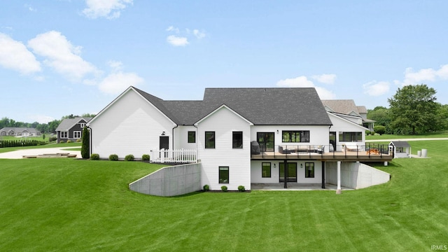 11306 Fishers Pond, Middlebury, IN 46540 - rear view of property featuring a yard, a wooden deck, a patio, and a shingled roof