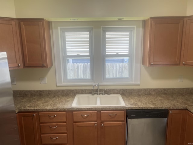 1715 Everett St, Lafayette, IN 47905 - kitchen featuring appliances with stainless steel finishes, dark countertops, and brown cabinetry