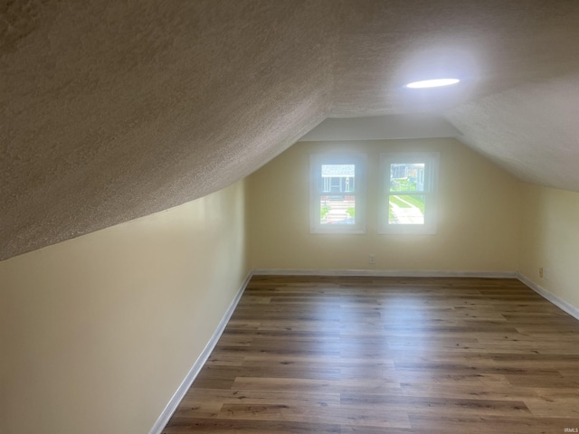 1715 Everett St, Lafayette, IN 47905 - bonus room with a textured ceiling, wood finished floors, and vaulted ceiling