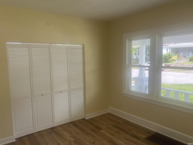 1715 Everett St, Lafayette, IN 47905 - unfurnished bedroom with wood finished floors, multiple windows, and a closet