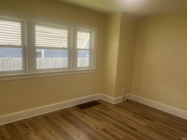 1715 Everett St, Lafayette, IN 47905 - empty room with baseboards and dark wood-style flooring