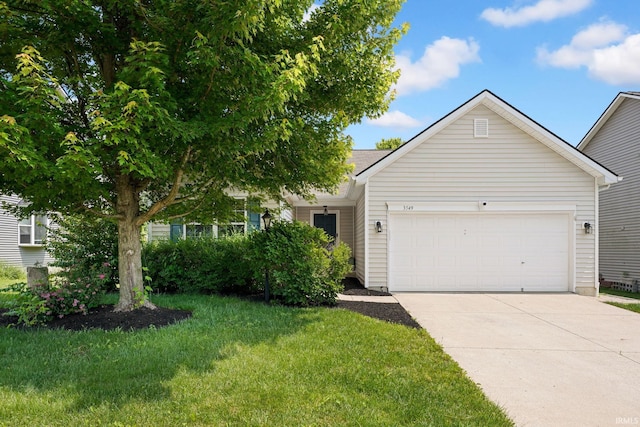 3549 S Wickens St, Bloomington, IN 47403 - view of front of property featuring a garage, driveway, and a front yard