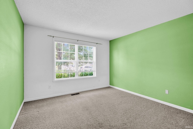 3549 S Wickens St, Bloomington, IN 47403 - unfurnished room featuring a textured ceiling and carpet floors