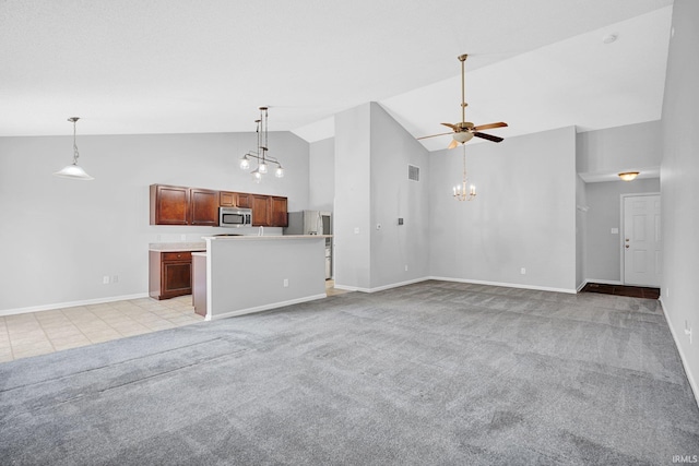 3549 S Wickens St, Bloomington, IN 47403 - unfurnished living room featuring high vaulted ceiling, light carpet, a ceiling fan, a chandelier, and light tile patterned floors