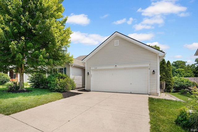 3549 S Wickens St, Bloomington, IN 47403 - view of front of house with driveway, a garage, and a front lawn