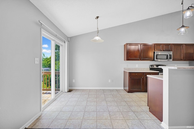 3549 S Wickens St, Bloomington, IN 47403 - kitchen with appliances with stainless steel finishes, vaulted ceiling, light countertops, and hanging light fixtures