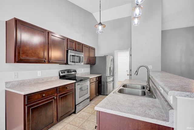 3549 S Wickens St, Bloomington, IN 47403 - kitchen with stainless steel appliances, high vaulted ceiling, light countertops, a peninsula, and light flooring