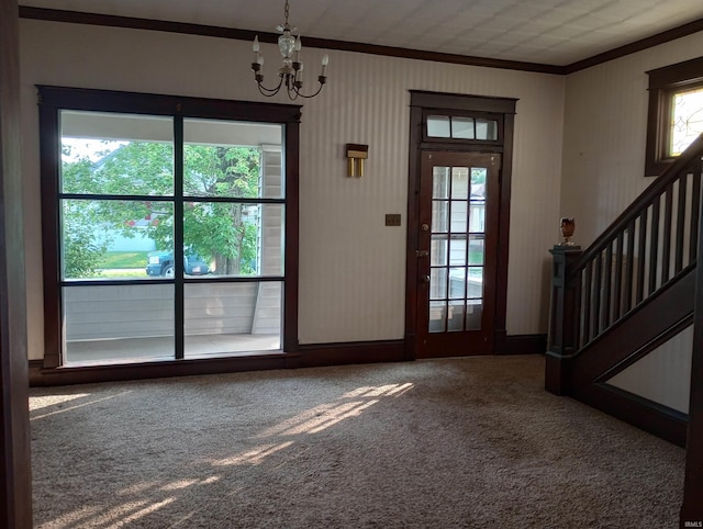1340 Broadway St, Vincennes, IN 47591 - carpeted foyer with crown molding, a chandelier, and stairway