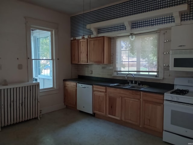 1340 Broadway St, Vincennes, IN 47591 - kitchen with white appliances, radiator heating unit, dark countertops, decorative backsplash, and brown cabinets