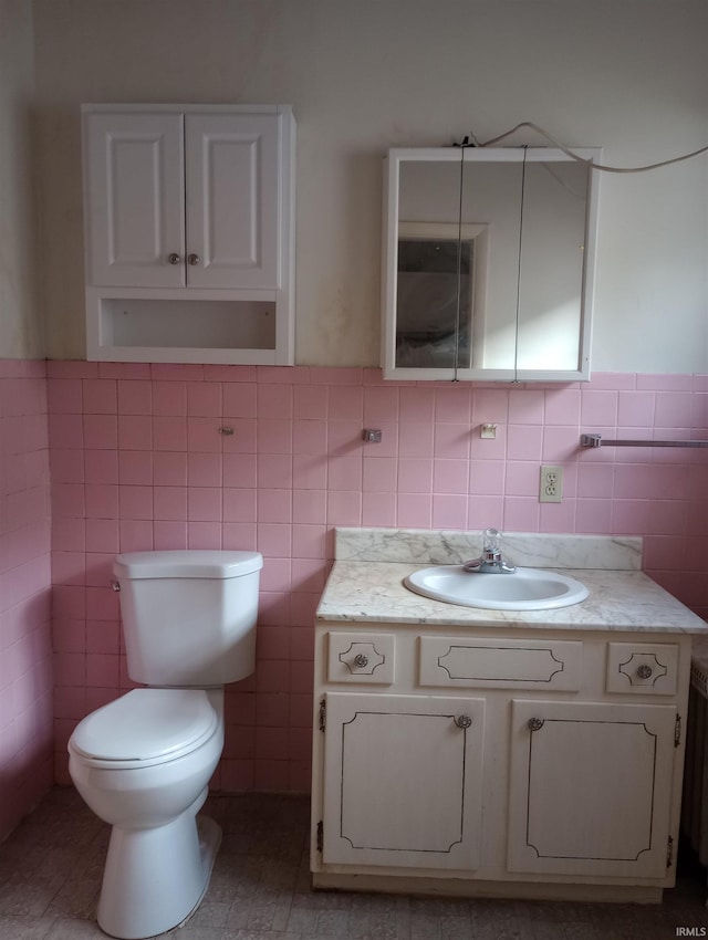 1340 Broadway St, Vincennes, IN 47591 - bathroom with tile walls, vanity, and wainscoting