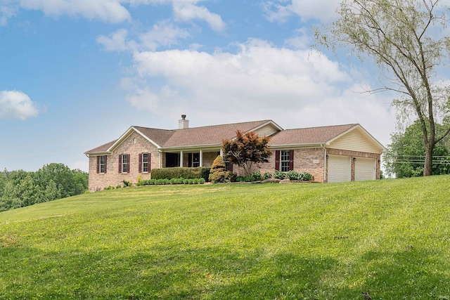 7486 S Ketcham Rd, Bloomington, IN 47403 - ranch-style home featuring brick siding, a garage, a chimney, and a front lawn