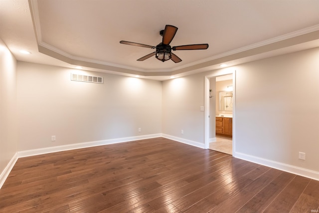 7486 S Ketcham Rd, Bloomington, IN 47403 - spare room featuring a raised ceiling, a ceiling fan, dark wood-style floors, crown molding, and recessed lighting