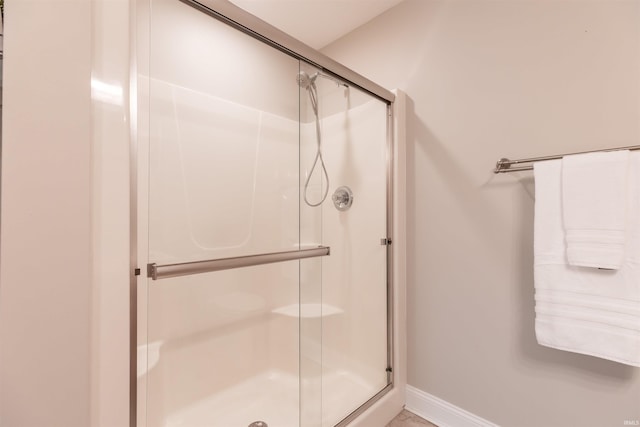 7486 S Ketcham Rd, Bloomington, IN 47403 - full bath featuring a shower stall and baseboards