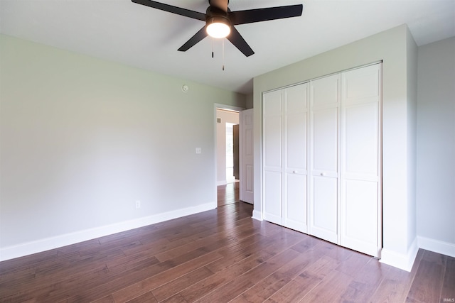 7486 S Ketcham Rd, Bloomington, IN 47403 - unfurnished bedroom featuring dark wood-type flooring, a closet, and ceiling fan