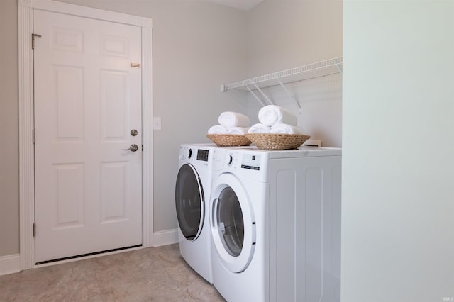 7486 S Ketcham Rd, Bloomington, IN 47403 - washroom featuring separate washer and dryer and baseboards