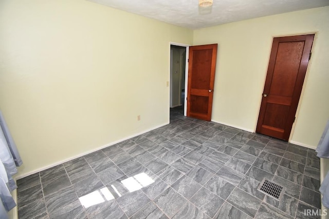 209 E Plum St, Linden, IN 47955 - unfurnished bedroom with baseboards