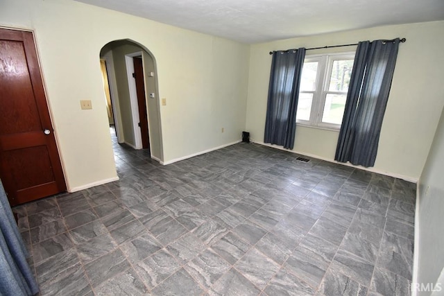 209 E Plum St, Linden, IN 47955 - unfurnished room with arched walkways and baseboards