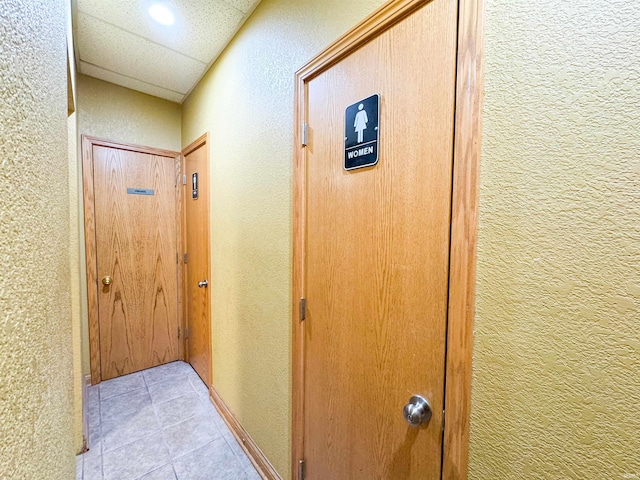 101 W Main St, Syracuse, IN 46567 - hall with a textured wall, light tile patterned floors, and recessed lighting
