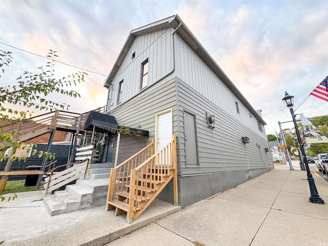 101 W Main St, Syracuse, IN 46567 - back of house with board and batten siding