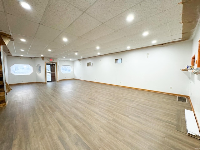 101 W Main St, Syracuse, IN 46567 - unfurnished living room with wood finished floors, a paneled ceiling, and recessed lighting
