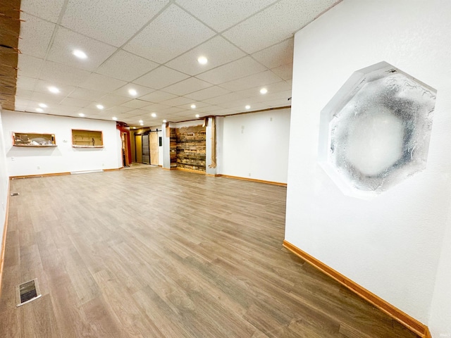 101 W Main St, Syracuse, IN 46567 - unfurnished living room featuring wood finished floors and recessed lighting