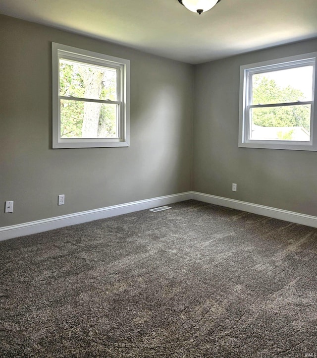 6711 Trier Rd, Fort Wayne, IN 46815 - empty room featuring healthy amount of natural light and carpet