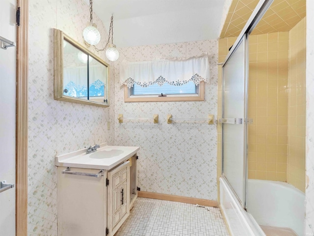 314 N Chauncey St, Columbia City, IN 46725 - full bath with vanity, tile patterned flooring, and shower / bath combination with glass door