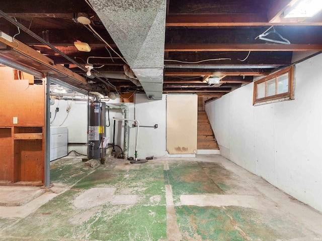 314 N Chauncey St, Columbia City, IN 46725 - unfinished below grade area with water heater, washer / dryer, and stairway