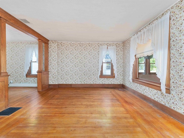 314 N Chauncey St, Columbia City, IN 46725 - empty room featuring wallpapered walls and light wood finished floors