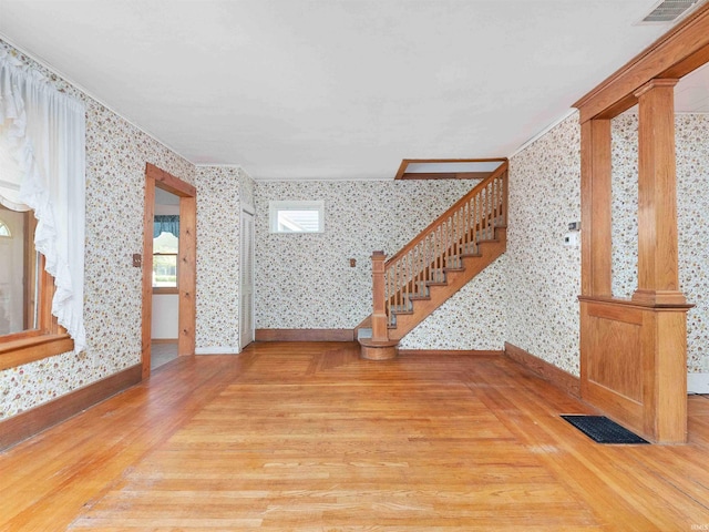 314 N Chauncey St, Columbia City, IN 46725 - foyer entrance with wallpapered walls, wood finished floors, and stairs
