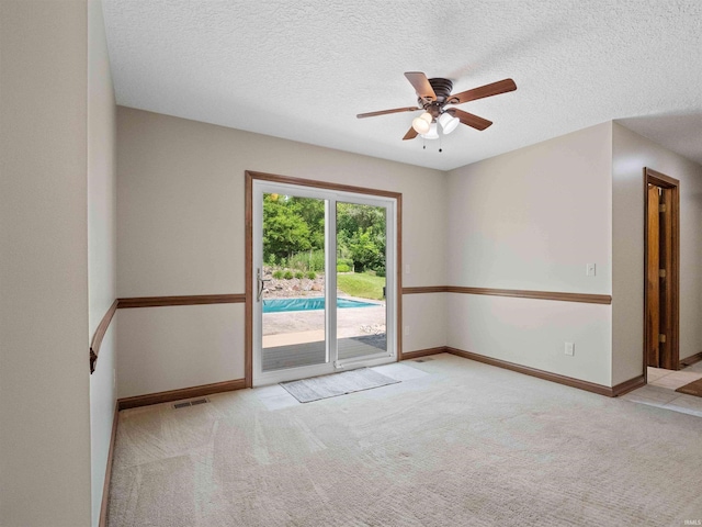 17723 Auburn Rd, Huntertown, IN 46748 - empty room featuring ceiling fan, carpet flooring, and a textured ceiling
