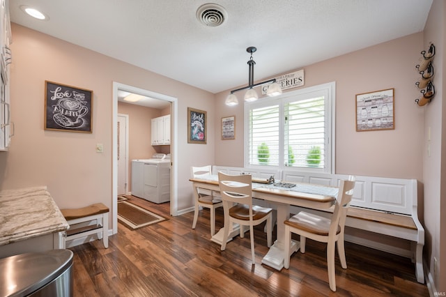 4501 N Wheeling Ave Unit 12-5, Muncie, IN 47304 - dining space featuring washing machine and clothes dryer and dark wood-type flooring