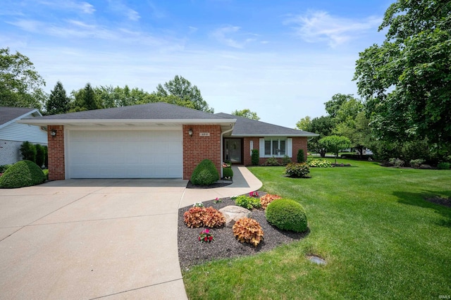 4501 N Wheeling Ave Unit 12-5, Muncie, IN 47304 - ranch-style home with brick siding, concrete driveway, a garage, and a front yard