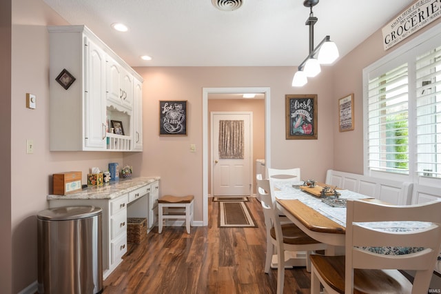 4501 N Wheeling Ave Unit 12-5, Muncie, IN 47304 - dining space featuring dark wood-style floors, recessed lighting, and built in desk
